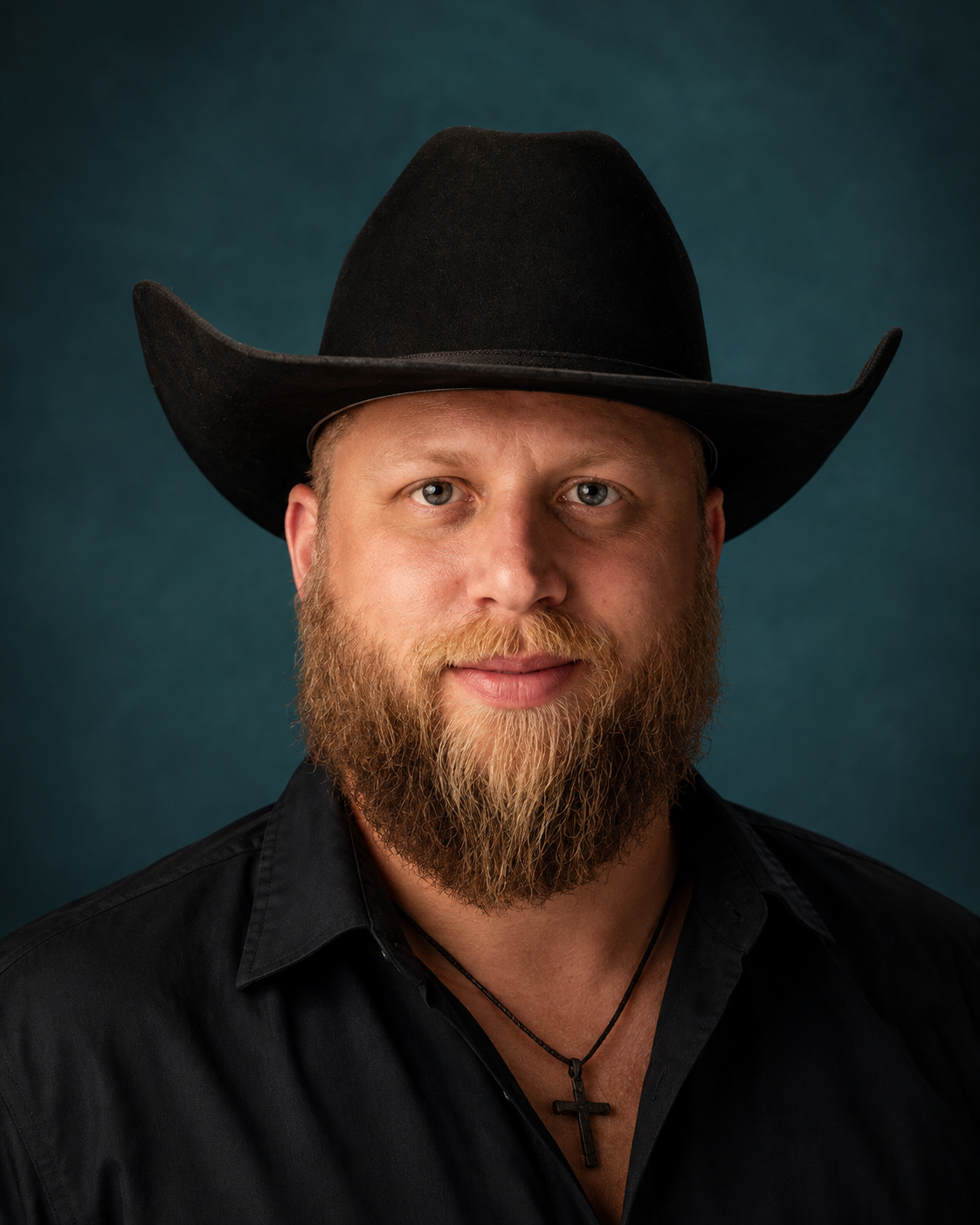 Portrait of a man wearing a black hat